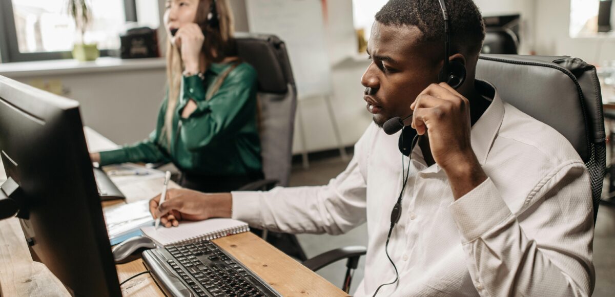 Fothion employees provide reliable IT support and services to a customer while working on their laptops.”