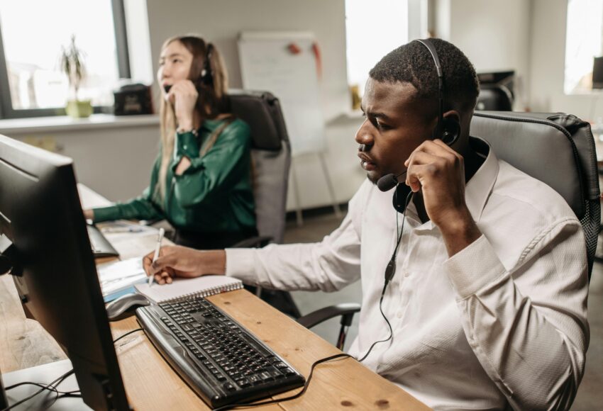 Fothion employees provide reliable IT support and services to a customer while working on their laptops.”