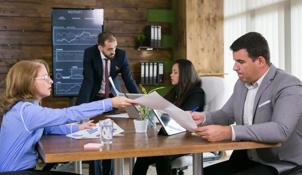 :IT professionals managing disaster recovery and business continuity systems in a modern Los Angeles office.