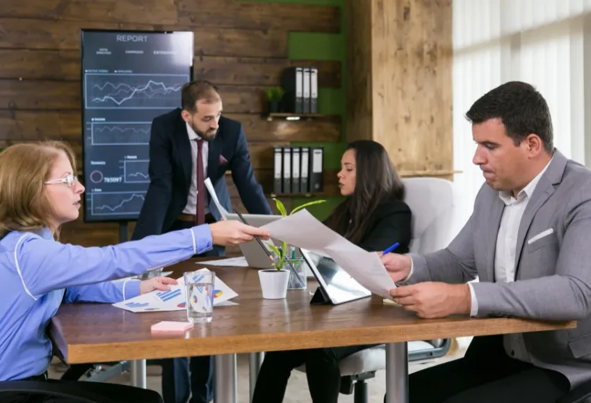 :IT professionals managing disaster recovery and business continuity systems in a modern Los Angeles office.